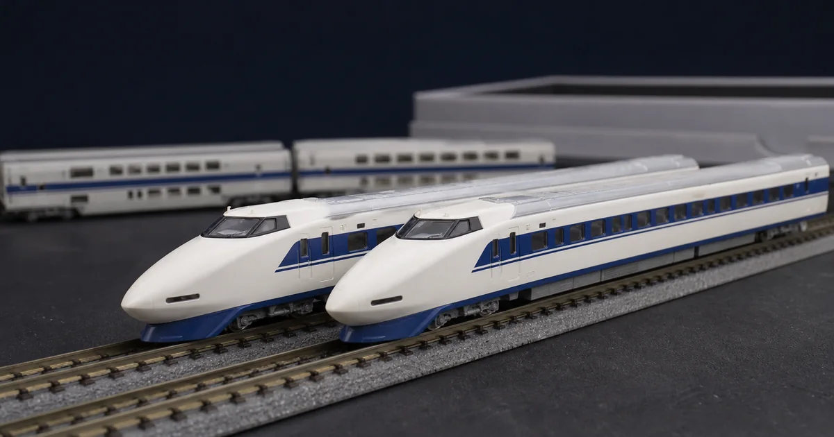 兩列象牙白藍帶鯊魚鼻高速列車模型的工作台比較情境